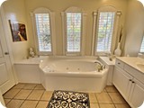 opulent master bath with jacuzzi tub, separate shower